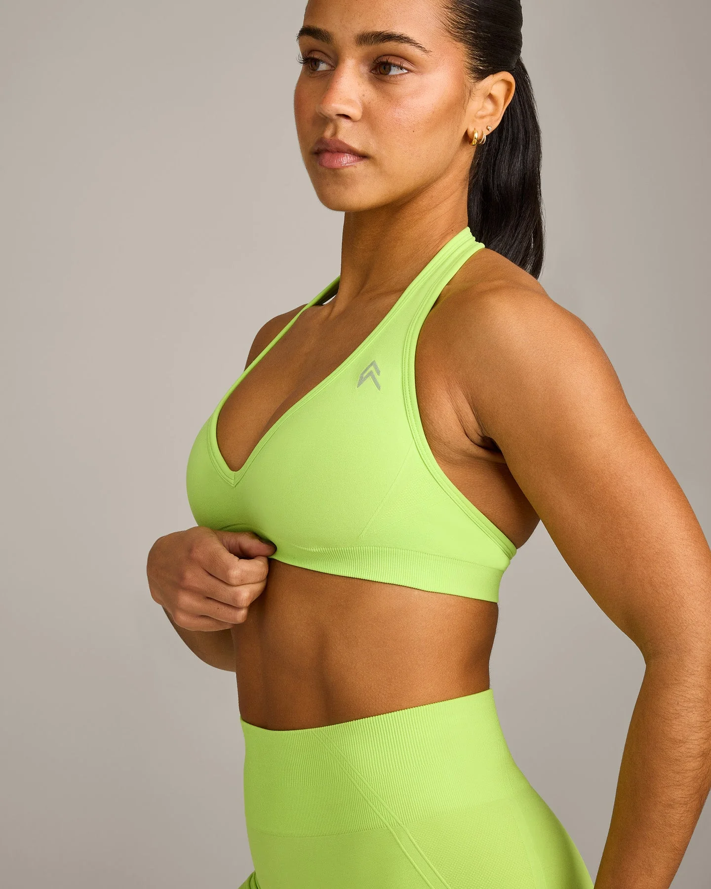 EffortlessLift™ Seamless Halter Neck Sports Bra with Grey Logo | Citrus Green - Image 5