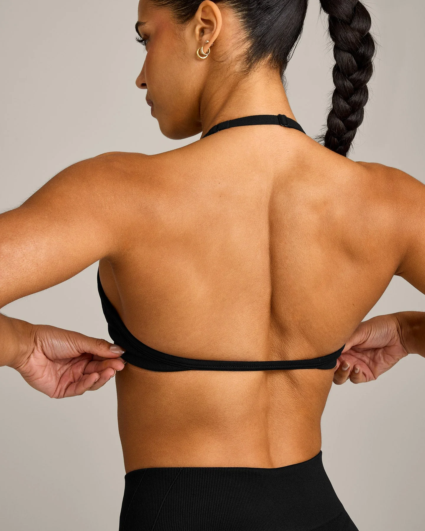 EnhanceLift™ Seamless Minimal Halter Neck Bralette with Grey Logo | Black - Image 4