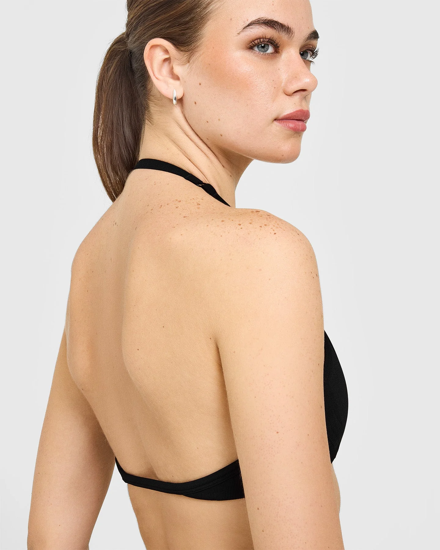 EnhanceLift™ Seamless Minimal Halter Neck Bralette with White Logo | Black - Image 4