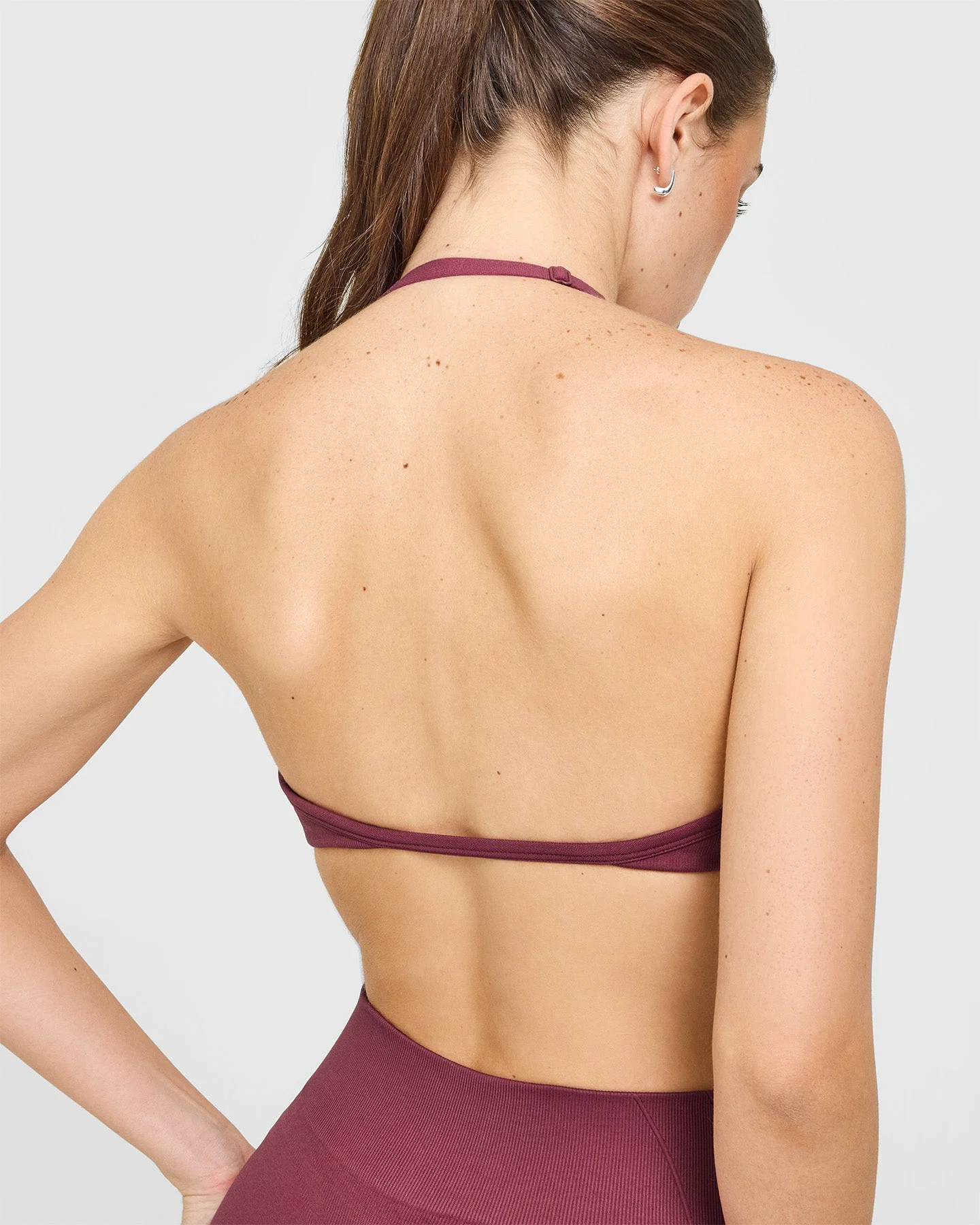 EnhanceLift™ Seamless Minimal Halter Neck Bralette with White Logo | Burnt Maroon - Image 5