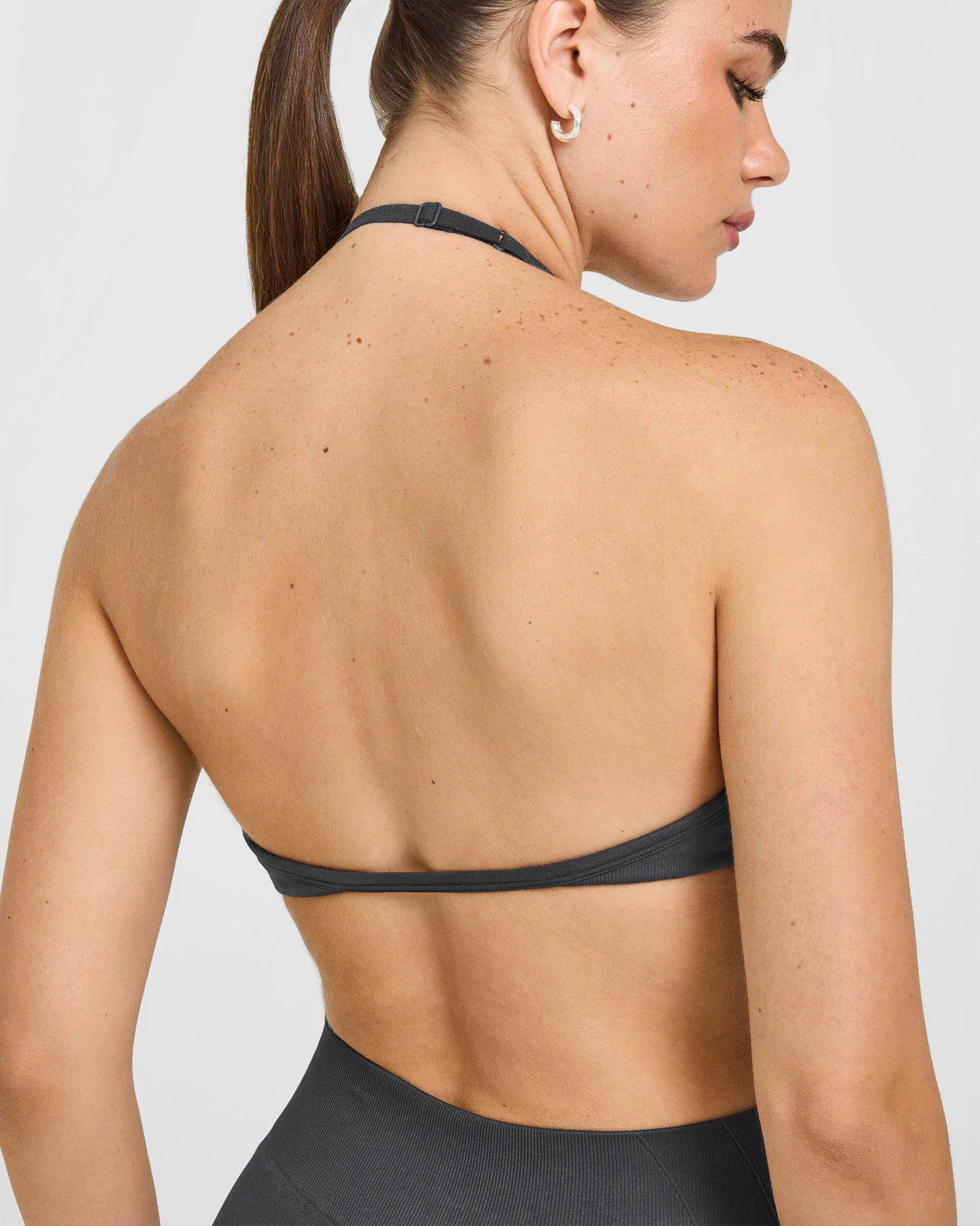 EnhanceLift™ Seamless Minimal Halter Neck Bralette with White Logo | Coal - Image 4