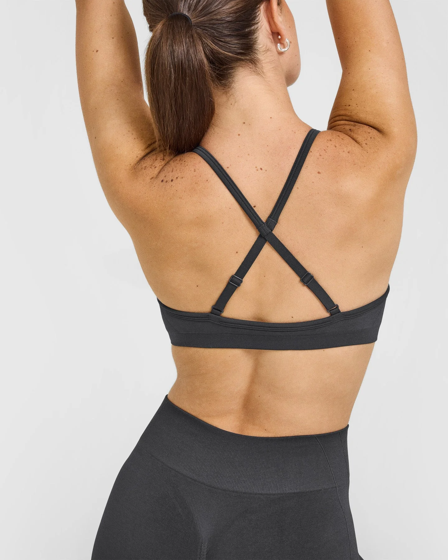 EnhanceLift™ Seamless Strappy Sports Bra with White Logo | Coal - Image 4