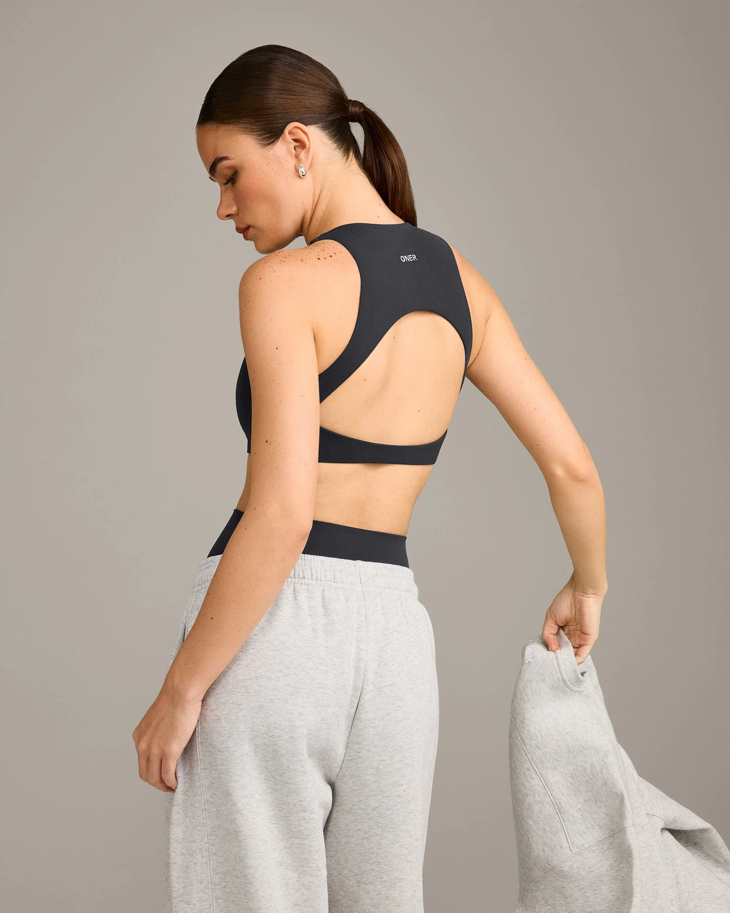 SoftMotion™ High Neck Sports Bra with Grey Logo | Coal - Image 2