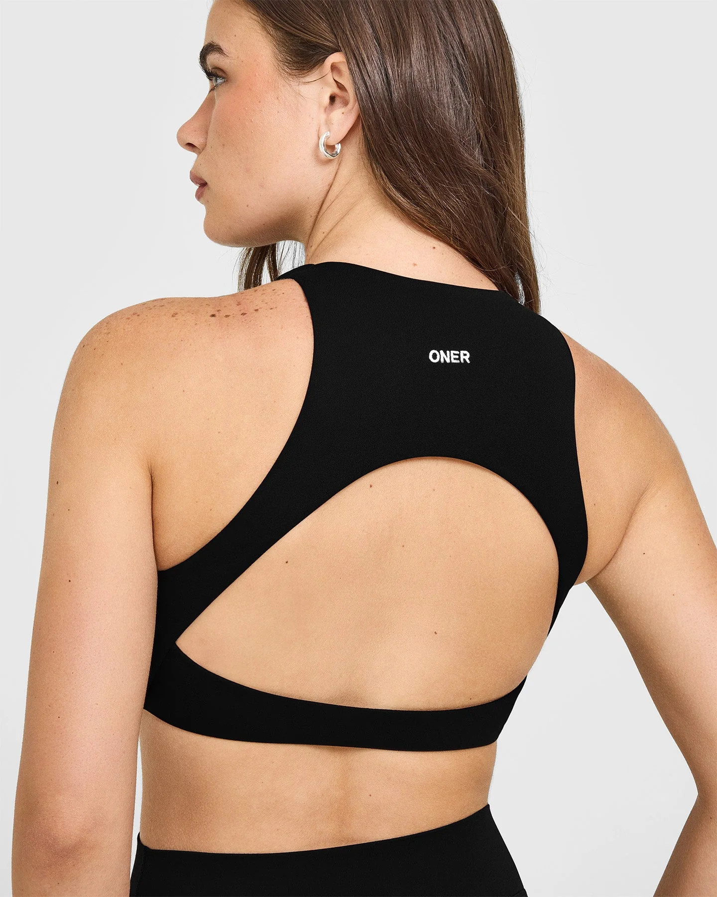 SoftMotion™ High Neck Sports Bra with White Logo | Black - Image 4