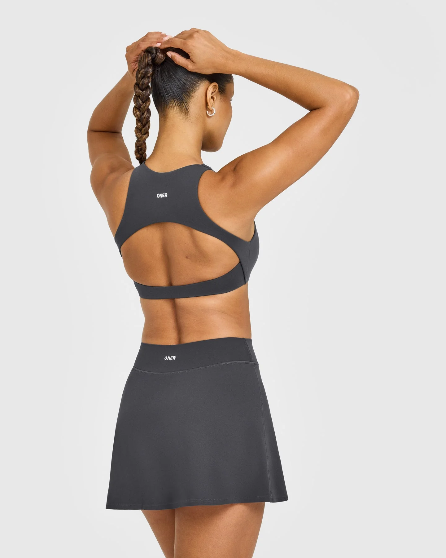 SoftMotion™ High Neck Sports Bra with White Logo | Coal - Image 2
