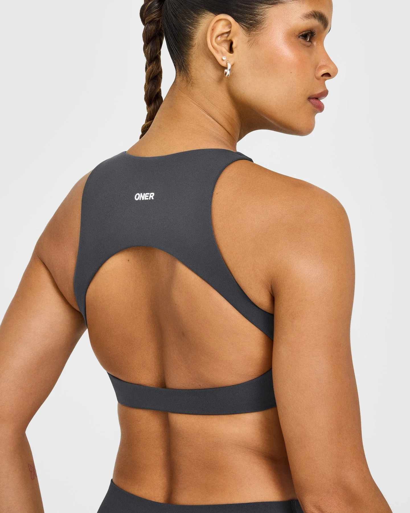 SoftMotion™ High Neck Sports Bra with White Logo | Coal - Image 4