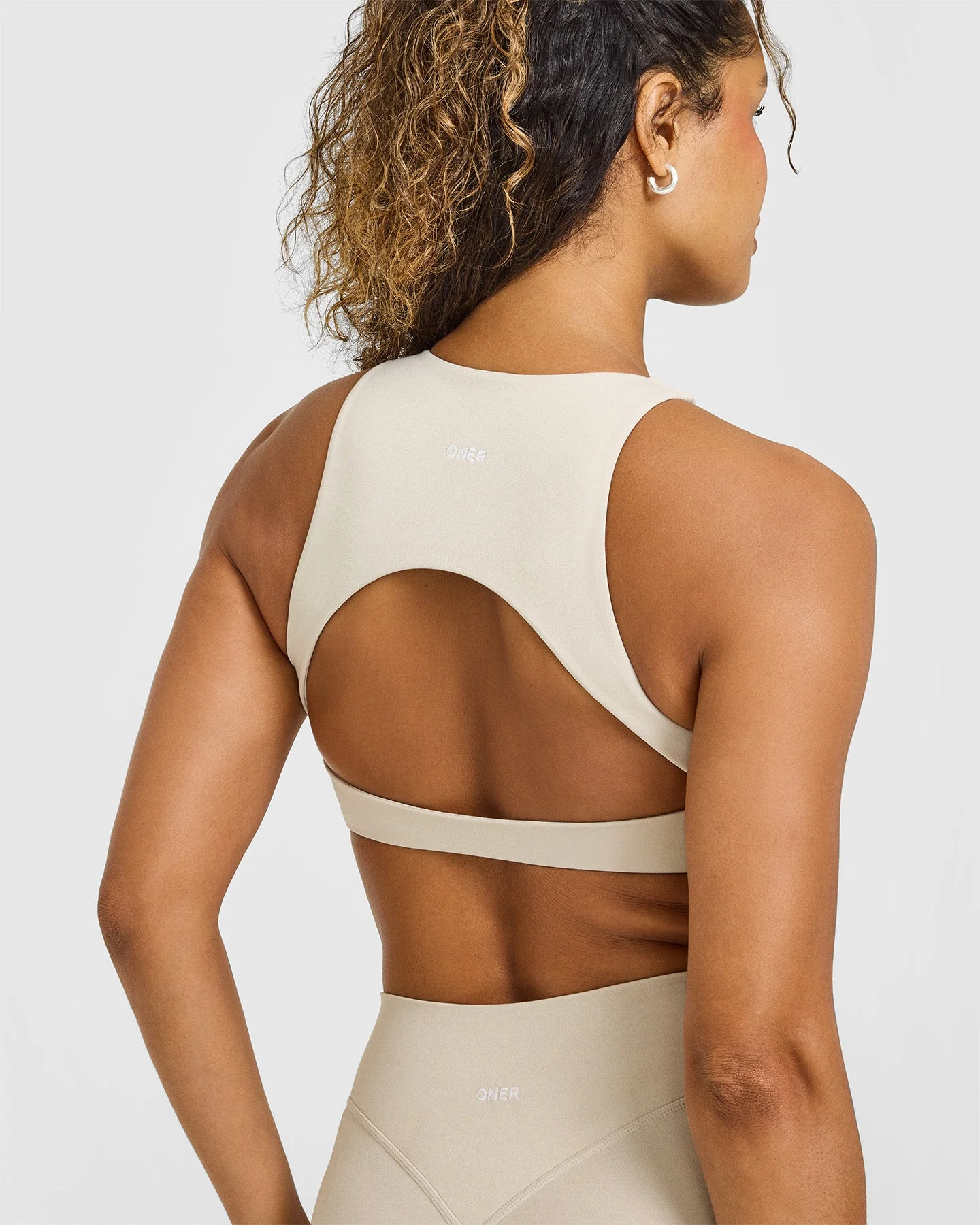 SoftMotion™ High Neck Sports Bra with White Logo | Sand - Image 4