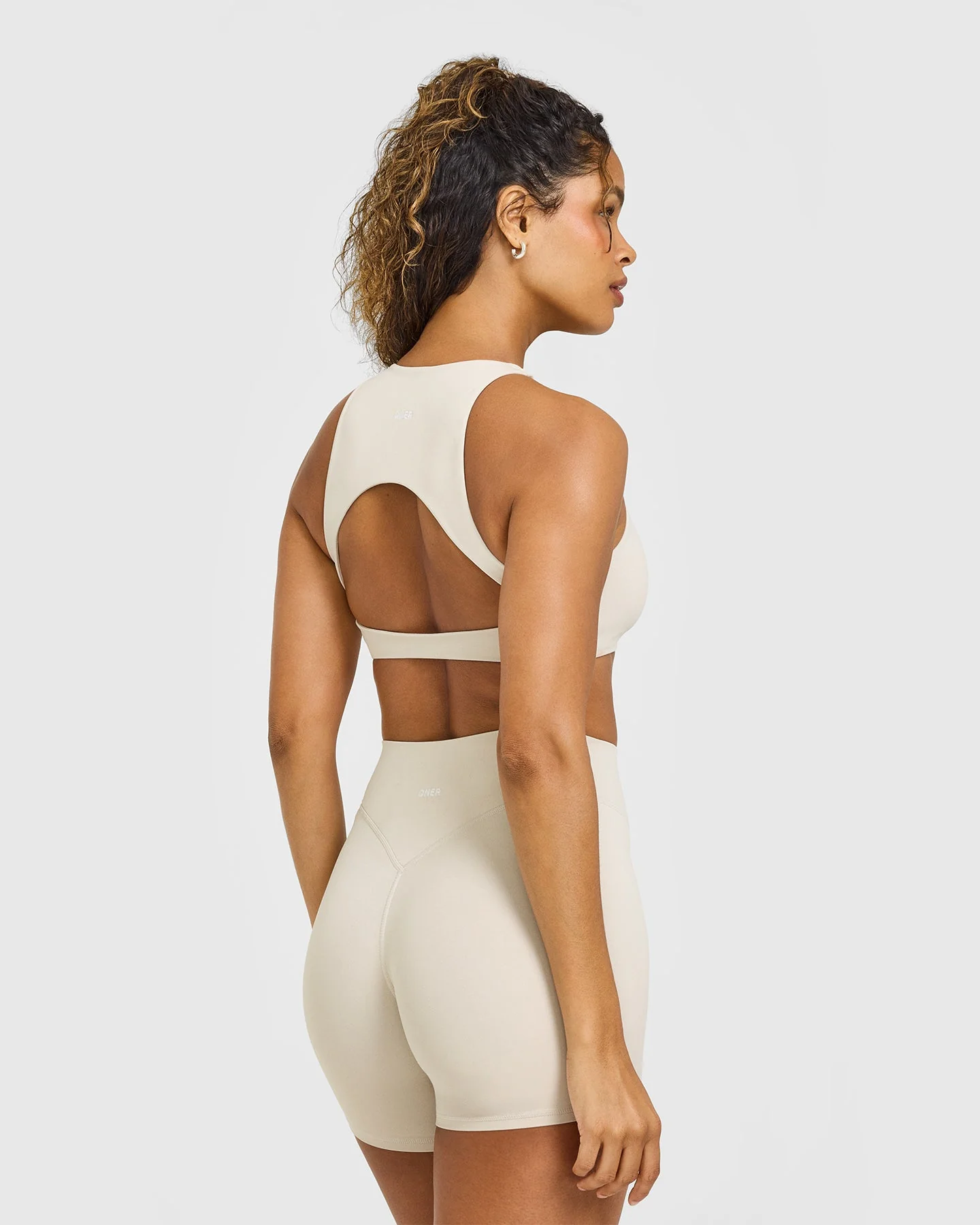 SoftMotion™ High Neck Sports Bra with White Logo | Sand - Image 6