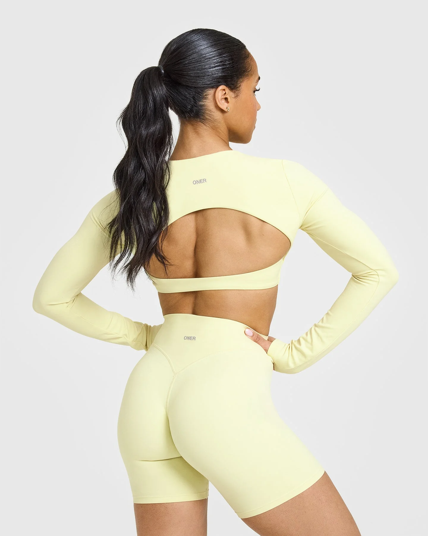 SoftMotion™ Long Sleeve Crop Top with White Logo | Pastel Yellow - Image 2