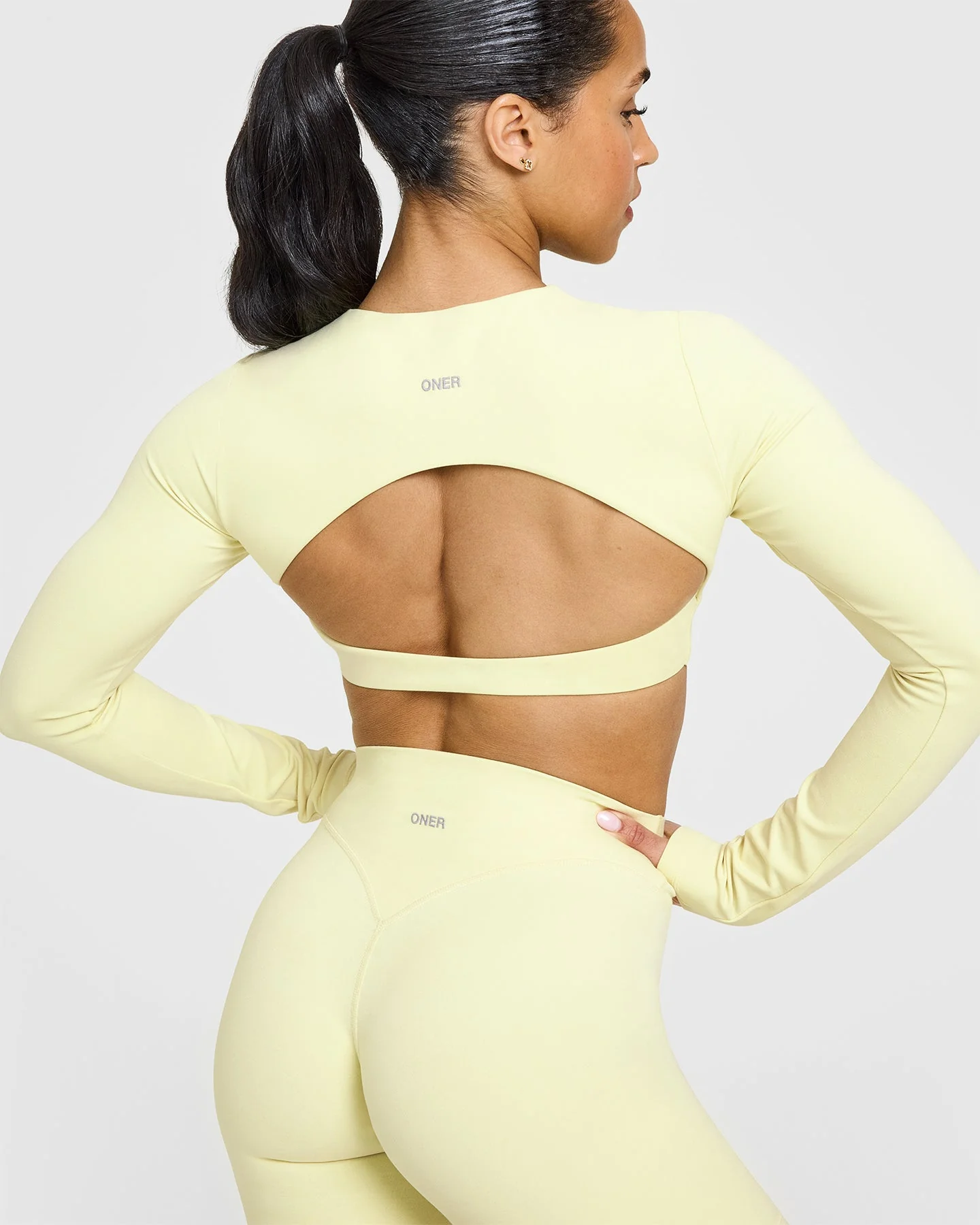 SoftMotion™ Long Sleeve Crop Top with White Logo | Pastel Yellow - Image 4