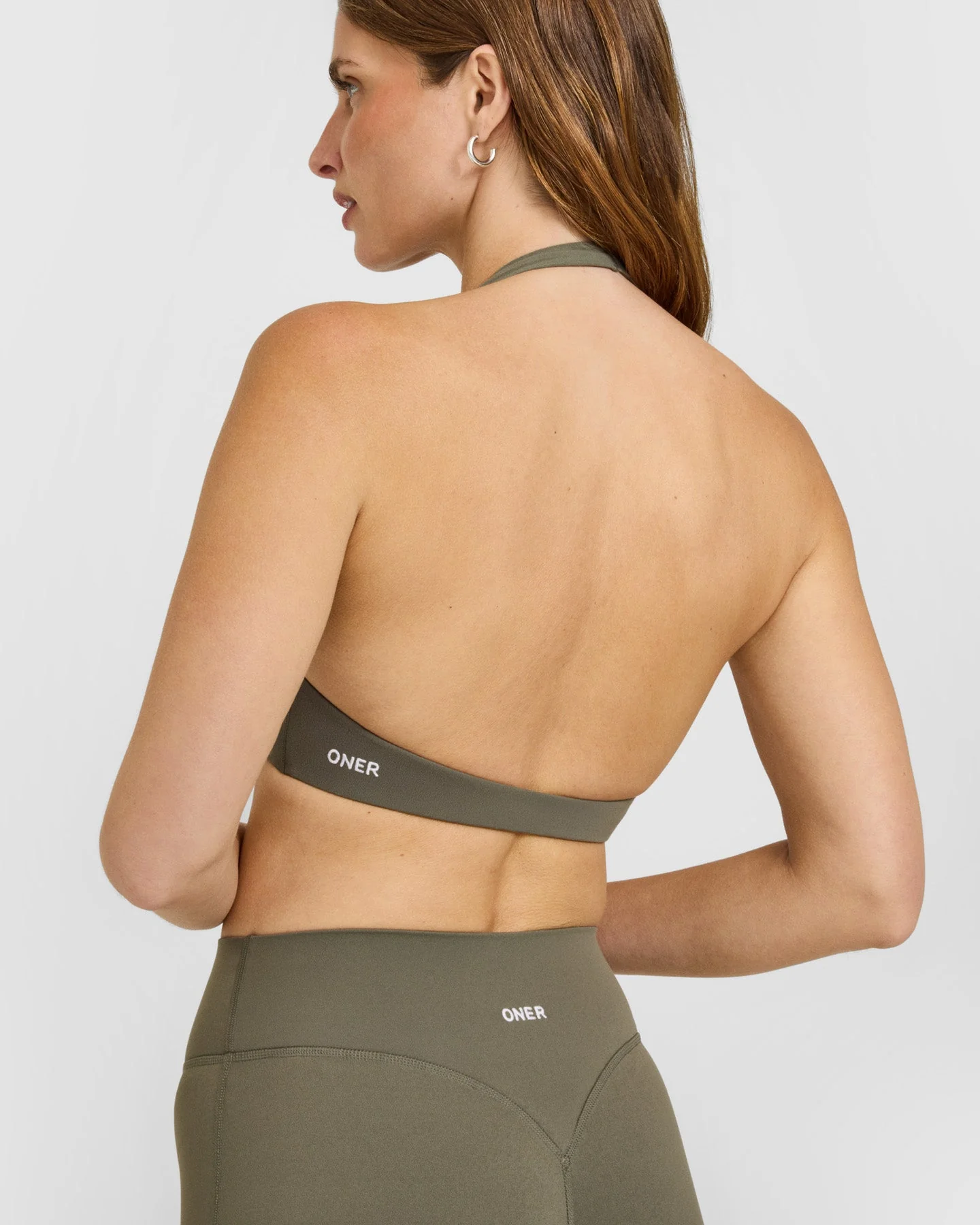 SoftMotion™ Minimal Halter Neck Bralette with White Logo | Alpine Green - Image 4