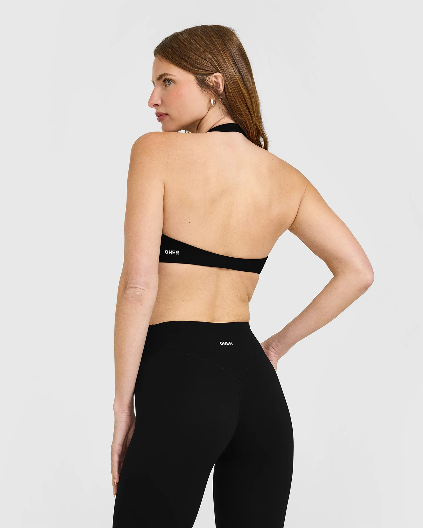 SoftMotion™ Minimal Halter Neck Bralette with White Logo | Black - Image 2