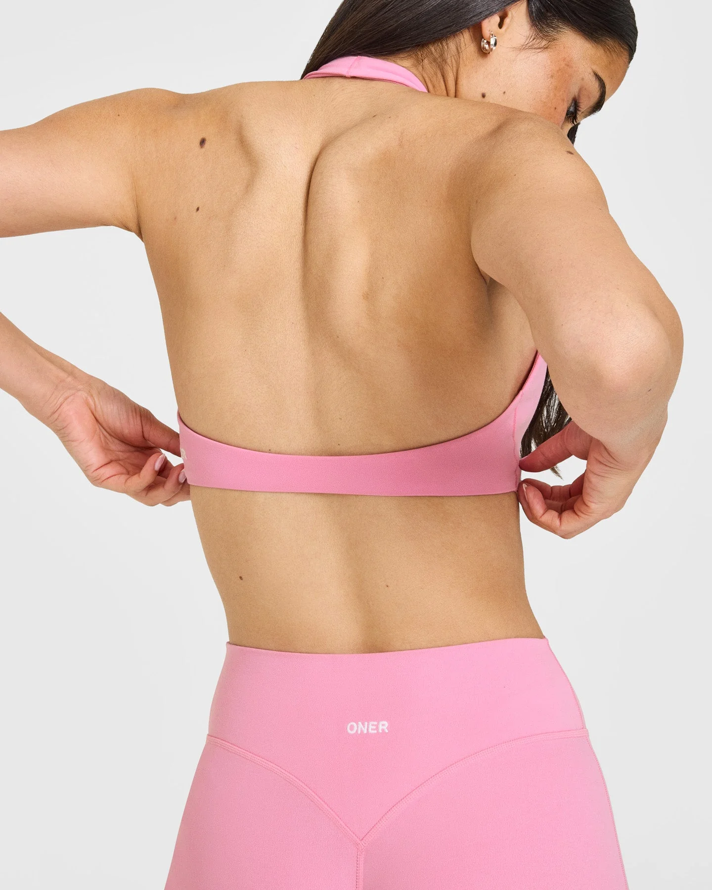 SoftMotion™ Minimal Halter Neck Bralette with White Logo | Rose Pink - Image 4