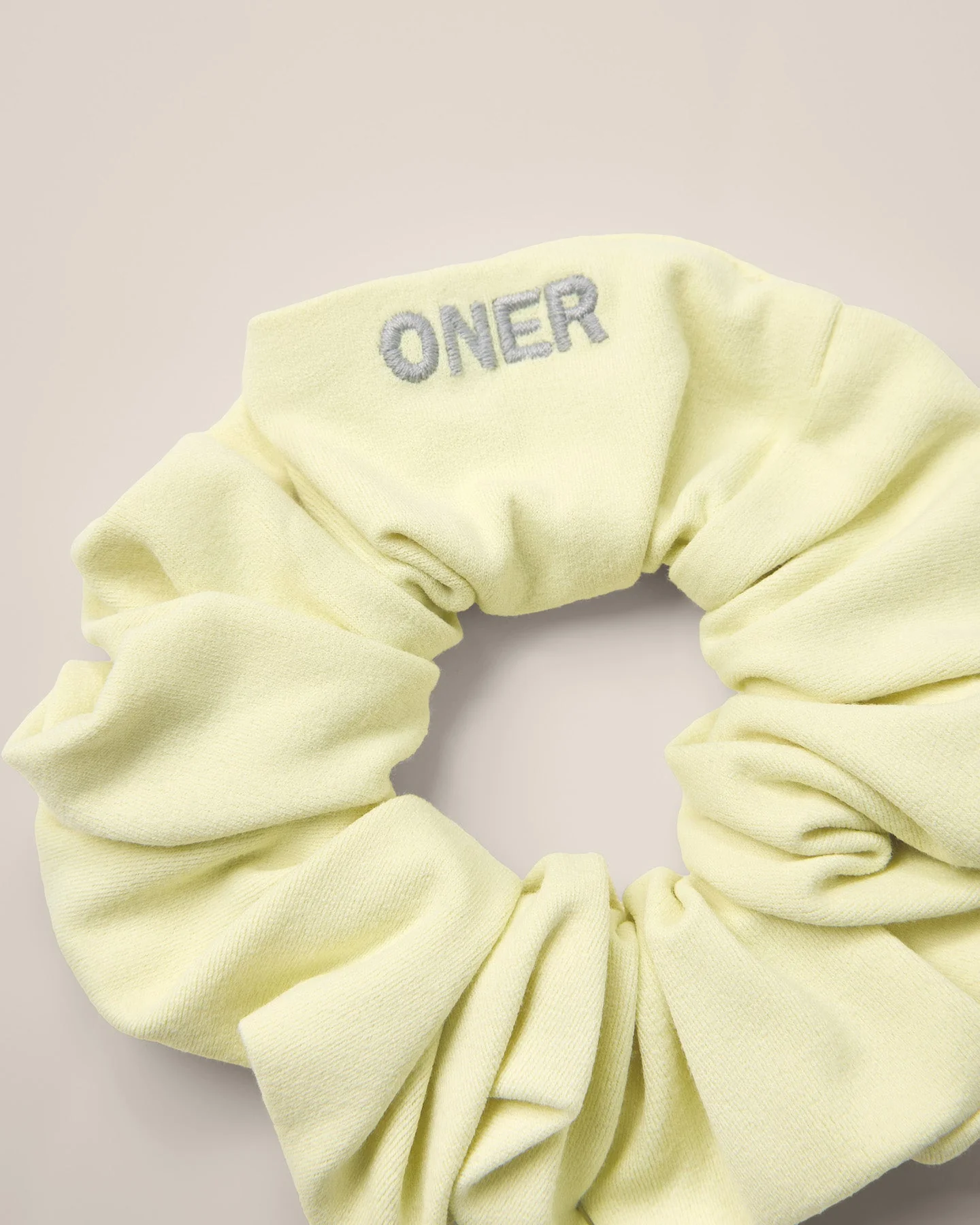 SoftMotion™ Scrunchie with Grey Logo | Pastel Yellow - Image 6